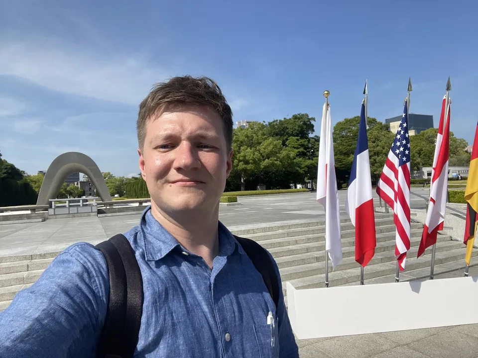 Dmitry in Hiroshima with international flags